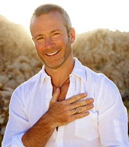 Man in yoga pose outdoors.